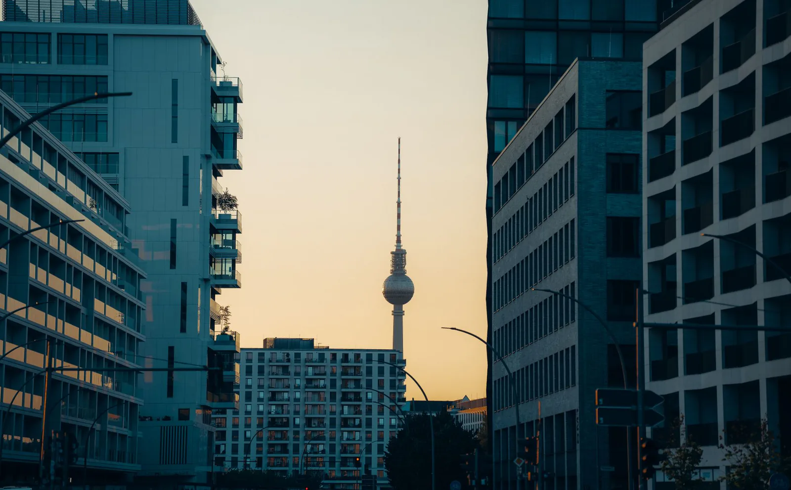 Berlin TV Tower framed by the city skyline at sunset